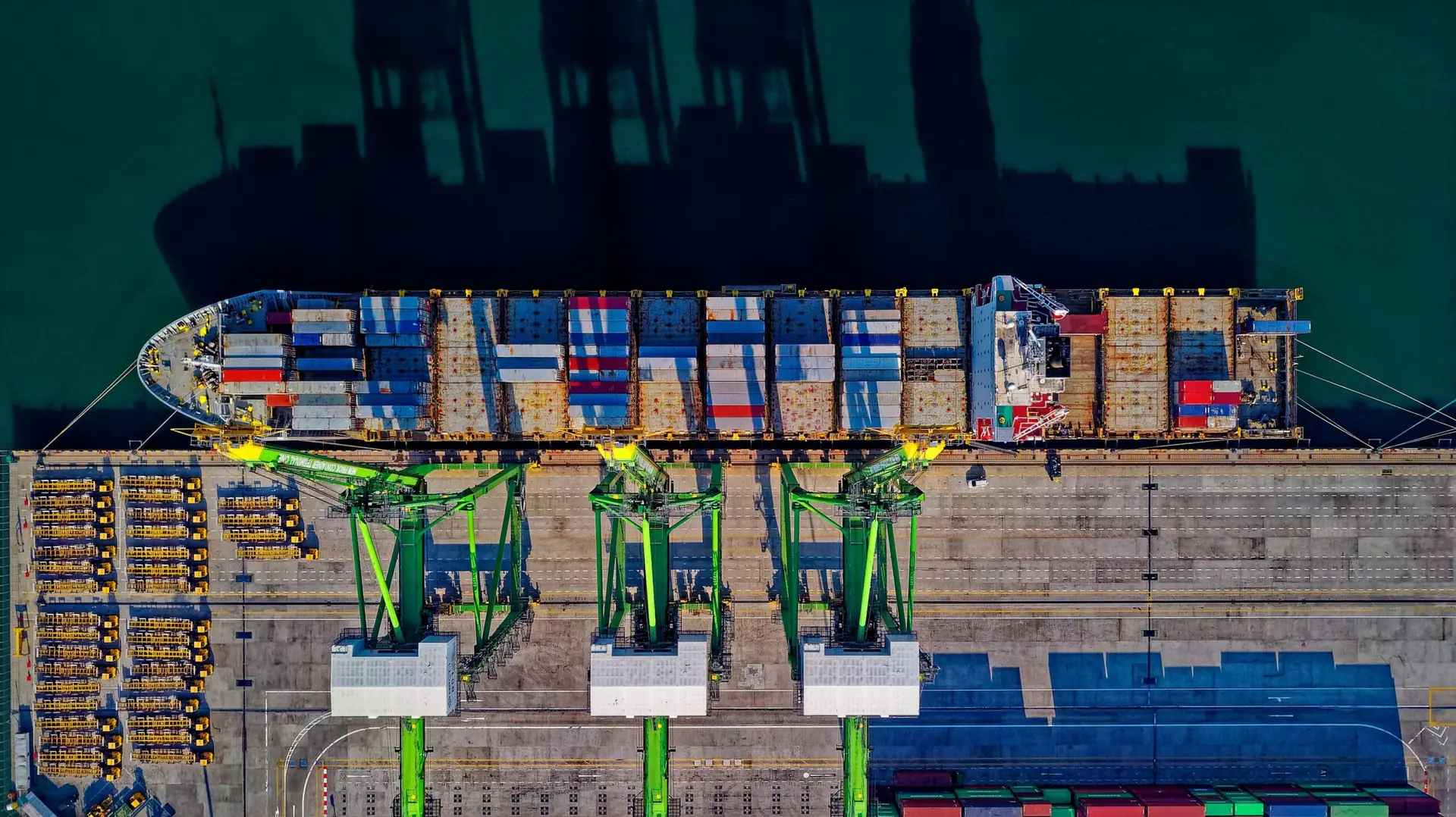 Aerial view of a container ship being loaded at port
