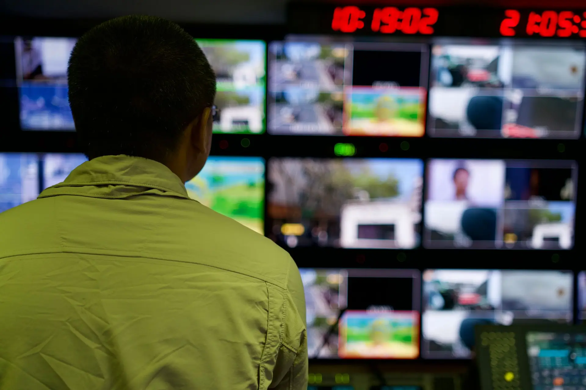 Operator monitoring live video feeds in a control room